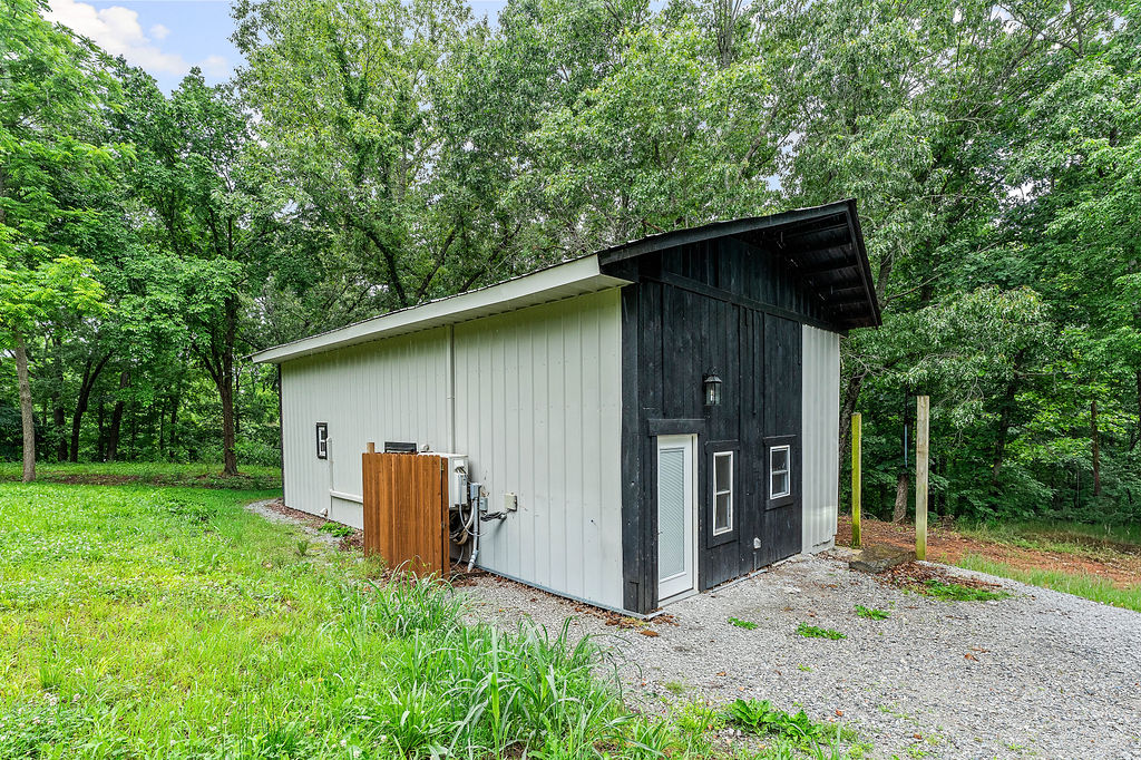 Welcome to your cozy cabin retreat at 20619 Wade Rd, Springdale, AR 72764! This charming 2-bedroom, 1-bathroom home sits on a private, wooded 0.5-acre lot with no covenants, making it perfect for those seeking freedom and space – livestock welcome! The cabin features a durable metal roof and siding, while the interior blends modern and rustic elements for a warm, inviting feel. Features include a comfortable loft with one-bedroom and one bedroom and bathroom on the main level and has convenient stackable washer and dryer. Property created to impress with vaulted ceilings that enhance the open atmosphere. Three mini-split units provide efficient heating and cooling throughout the year.
Enjoy public water access and a reliable septic tank system. For added peace of mind, this property comes with a transferable home warranty. Experience ultimate privacy and the serene beauty of nature in this unique Springdale cabin in the woods!