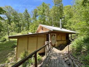 This 5 acres has multiple water sources on it and could make a great homestead. There is already a unique cabin built in the woods and there is another building site next to Lay creek and a spring fed pond. There is a RV hookup on site already. About 30 minutes to both Tyler Bend Campground and Dillards Ferry access on the Buffalo National River. Property will not qualify for RD or FHA loans.