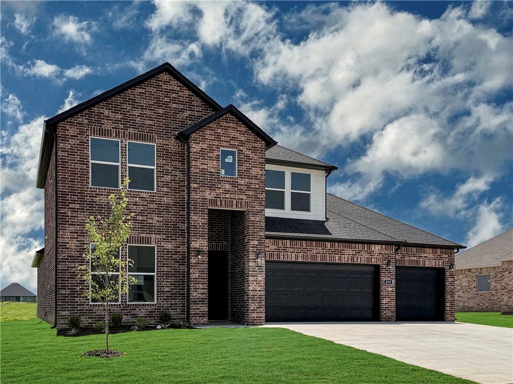 The Aurora Plan in Renley Rae in Springdale, AR! This 2-story plan offers 4 bedrooms, 3 bathrooms, and an upstairs game room! These homes feature engineered wood flooring throughout the first floor, tile flooring in the primary bathroom, and carpet in all upstairs bedrooms and game room. The kitchen features quartz countertops, 42’’ cabinets, black hardware, and a gas range. The living room features a beautiful modern fireplace with a poplar mantle! Fans are included in all bedrooms, living room, and upstairs game room! The primary ensuite will have a walk-in shower, separate tub, and quartz countertops! The exterior of these homes will have 4-sides brick with siding (per plan) with a 3-car garage! Each home will have a lovely covered back patio. Taxes, HOA, and parcel TBD. Home is located in Tontitown/Springdale.