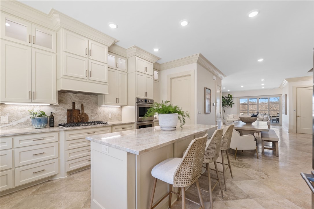 Walk to Wilson Park, bike the Razorback Greenway, and reach Dickson Street or the Downtown Fayetteville Square in minutes from this beautifully designed luxury townhome at 837 N Gregg Avenue. Perfectly positioned alongside the Greenway and near the University of Arkansas, this three-level residence offers exceptional access to dining, entertainment, outdoor recreation, and Fayetteville Public Schools. Inside, enjoy an open-concept layout with a full eat-in kitchen designed for entertaining, three full bathrooms, two half baths, and thoughtfully designed living spaces across all three levels. Two expansive balconies on the second and third floors provide ideal spaces for relaxing or hosting guests. With its unbeatable location and flexible layout, this property also presents excellent potential as a second home, game-day retreat, or investment opportunity.