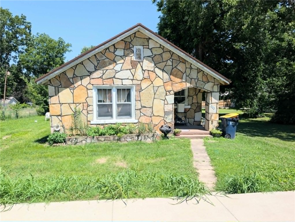 Welcome home to this charming 2-bedroom, 1-bath stone house offering timeless character and meaningful updates! With over 824 square feet of comfortable living space, this home is move-in ready and waiting for its new owners. Recent improvements include a new metal roof installed in 2024, updated HVAC system in 2025, and updated plumbing in 2020, giving buyers peace of mind for years to come. The property also includes a convenient outbuilding, perfect for storage, hobbies, or workshop space. Whether you're a first-time homebuyer searching for an affordable place to call your own or looking to downsize without sacrificing comfort, this home is an excellent fit. Enjoy the charm of stone construction, a welcoming atmosphere, and a location just minutes from shopping, dining, schools, and everything Harrison has to offer.The Refrigerator and range were updated in 2022 and stay with the property. Don't miss this opportunity to own a solid, updated home in a convenient location!
