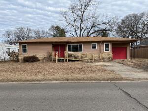 3 bedroom 1 1/2 bath home on large lot. Fenced back yard and storage building. See documents for list of improvements need to qualify for loan.