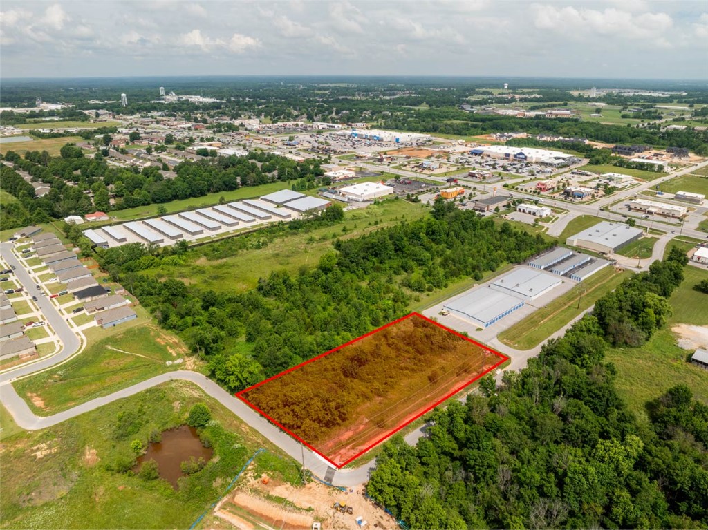 Prime Commercial or Development Opportunity in Siloam Springs! Looking for the perfect spot to launch your business, expand your portfolio, or build a specialized facility? This high-potential vacant parcel offers the ideal blend of highway visibility and secure, tucked-away positioning. Key Features: Unbeatable Location: Situated right off heavily trafficked Hwy 412 in fast-growing Siloam Springs. Strategic Placement: Located directly behind an established self-storage facility, providing excellent buffering from the main road while maintaining effortless highway access. Versatile Potential: A blank canvas perfect for light industrial use, equipment storage, a commercial workshop, or an expansion of neighboring commercial ventures. Don't miss out on acreage in this high-demand area. Drive by and imagine the possibilities today!