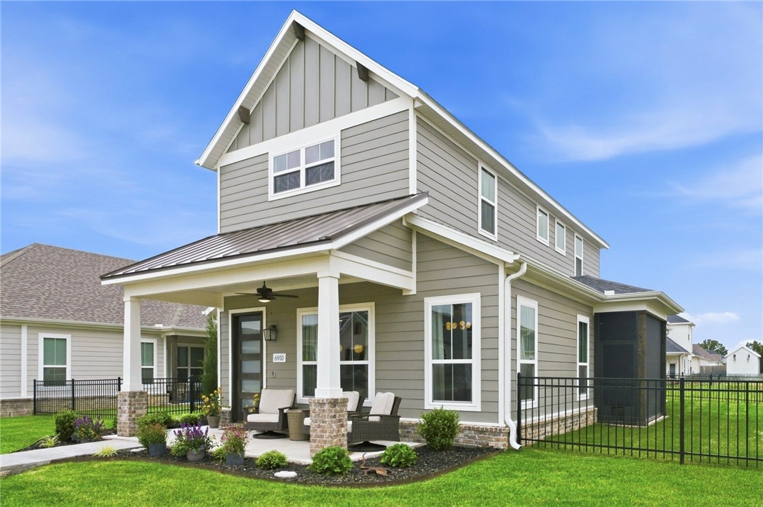 Better than new! This 1+ year-old Dahlia plan by Buffington Homes boasts $100k in thoughtfully selected upgrades. Bathed in light from abundant windows, the spectacular kitchen features frosted white oak ceiling-height cabinets, an oversized island with double-sided storage, premium gas cooktop & wall oven. Enjoy easy main-level living with a large 1st-floor primary suite & a flex room enclosed by stylish barn doors. Upstairs offers 2 spacious bedrooms, a double-vanity bath & extra hallway windows that fill the space with light. Outdoors, relax on two distinct porches, including an enlarged side porch with a custom retractable privacy screen. The 2.5-car garage provides ample space for vehicles, bikes & hobbies, complete with a service door. Say goodbye to yard work—mowing, fertilizing, watering & weeding are entirely handled for you! Enjoy the Cottages at the Park pool & clubhouse. Steps to Shaw Family Park (trails, dog park, tennis, splash pad). Just 7 mins to I-49, this home perfectly blends luxury & lifestyle!