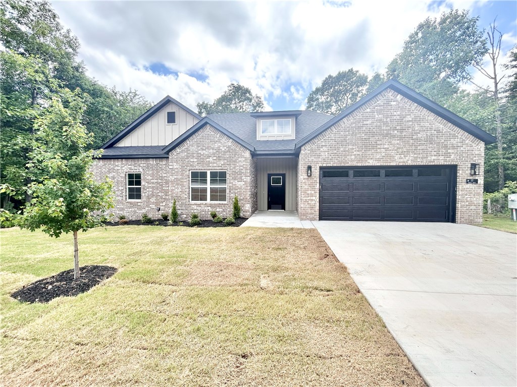 New construction on a flat wooded lot! Easy access to I-49, Highlands Golf Course, Lake Loch Lomond, and Branchwood Nature Trail / Recreation Center! Step inside to discover an inviting open concept design featuring beautiful floors that enhance the spacious feel of the home. NO CARPET! The stylish kitchen is equipped with a gas range, premium black stainless steeel appliances, 3 cm quartz countertops, custom cabinets, and a walk-in pantry. Entertain or unwind in the living area, complete with a stunning fireplace, or step out onto the huge back covered deck to enjoy the peaceful surroundings. The primary suite features a large walk-in tile shower! Buyer can receive $3,500 in closing costs when using the builder's preferred lender!