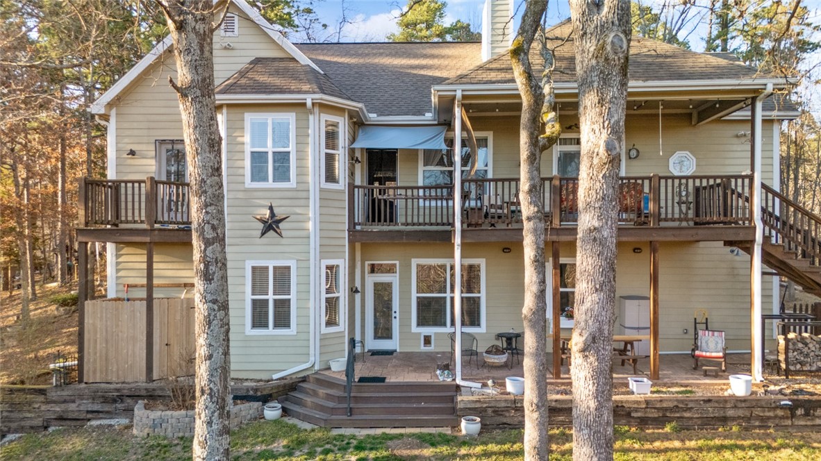 This Craftsman-inspired home, is a sanctuary in nature. If Privacy, peace, and tranquility is what you are seeking, this home welcomes you with 800 square feet of covered porches to enjoy the symphony of birds while enjoying your favorite beverage morning, noon, or night.  The enchanted gardens outside, have several landing areas to relax by the fire and enjoy family gatherings for many years to come, each area is uniquely curated so that you can relax and unwind in your own yard. The veranda offers a comfortable living space, ideal for gourmet back porch suppers, and summertime sunsets. This home was lovingly built with quality craftsmanship, 2X6 Construction, a newer HVAC system, hot and cold wash bin in the garage, and a designated home office space with a separate entrance to the basement which is excellent for a home based business, or separate entrance for extended family, multi-generational living, or guests. Washer, Dryer, and refrigerator all convey.