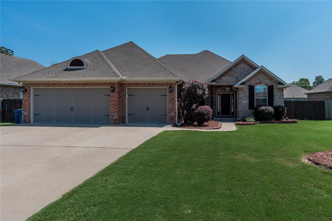 Great Home in popular Wildwood subdivision. Close to Schools, WM home office, XNA and all the Great amenities in Northwest Arkansas. This home is loaded with all the extras 4 bedrooms/ 2 1/2 baths/3 car garage, central vac, custom cabinets, surround sound inside and out.  It has a nice open split bedroom  floor plan with spacious rooms.  Neighborhood amenities include pool, playground and pavilion. Live in Wildwood for less than $250,000.  This one will not last long!