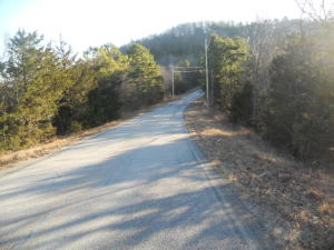 All wooded tract with paved road frontage.  Close to the lakes and Branson, MO.