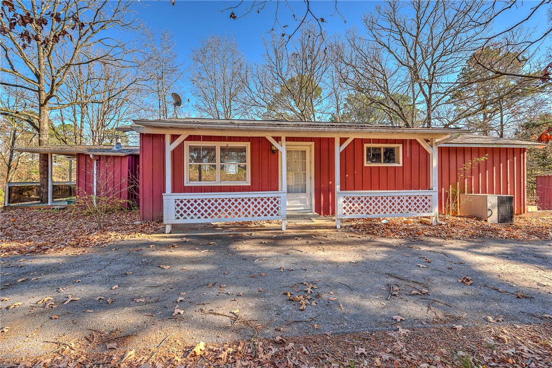 Charming 2 bedroom/1 bath home nestled on 3 acres. Home is open and inviting with additional bonus room perfect for extra living space, office or 4 season sunroom! Freshly painted, updated appliances. There is an unfinished basement that has existing egress windows to double your square footage! This is a perfect starter home, income property or relaxing retreat!