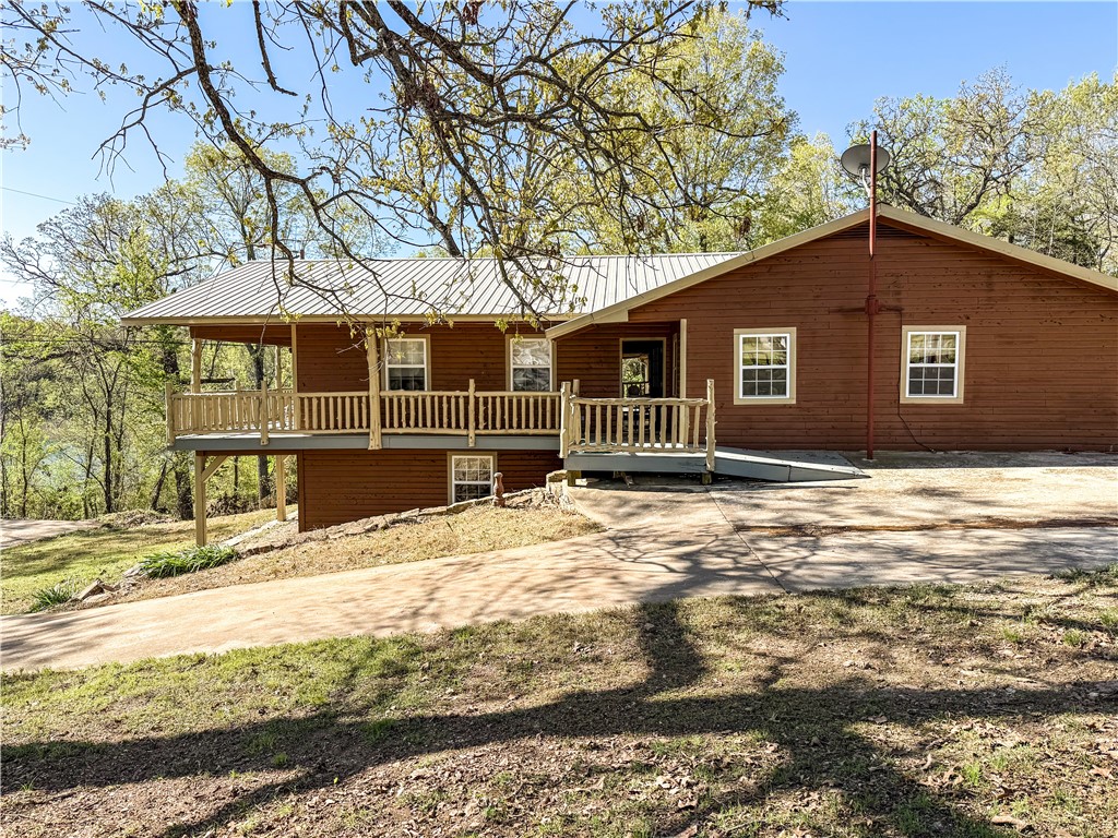 BULL SHOALS LAKE VIEW!!! Don't miss this beautiful home that has a lake view from every spot on the covered wrap around deck and adjoins corp of engineer land on 2 sides.. Throw in end of the road privacy and you have the perfect lake home. 4 bedrooms, 4 bathrooms gives you plenty of space for family and friends. Throw in a huge living room and dining room and you are ready to entertain. The 2 car garage is deep enough to keep your boat in, has a private well, concrete parking, covered carport, large propane tank, metal roof is 12 years old, hardwood floors, double oven and a handicap accessible bathroom.
