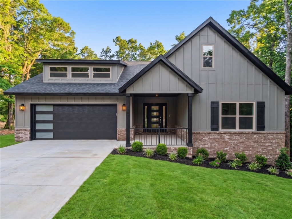 Welcome To Your Next Home At 1 Shildon Circle In Bella Vista — New Construction With Killer Curb Appeal, Zoned For Bentonville Schools! This 3 Bed, 2 Bath Split Plan Lives Large With A Wide Open Living, Kitchen, And Dining Space Anchored By A Sleek Electric Fireplace Framed In Chevron Shiplap With A Chunky Wood Mantel. The Kitchen Steals The Show: Two-Tone Custom Cabinets, Quartz Tops, Tile Backsplash, Under Cabinet Lighting, Custom Vent Hood, Brass Pendants, Pantry Cab, And Soft Close Doors And Drawers Throughout. Slide Out To A Sweet Back Deck For Grilling Season! The Primary Suite Is Your Private Retreat With A Walk-In Closet, Dual Vanity, And A Full Custom Tile Shower That Feels Straight Out Of A Magazine. You'll Find Nice Storage Tucked Everywhere, Because A Place For Everything Just Hits Different. Mountain Bike Trails Are Right Around The Corner, And This Beauty Wraps Up In About 30 Days. Come See It Before Someone Else Calls It Home! Agent Owned. (finished front pic is rendering with yard/landscape)