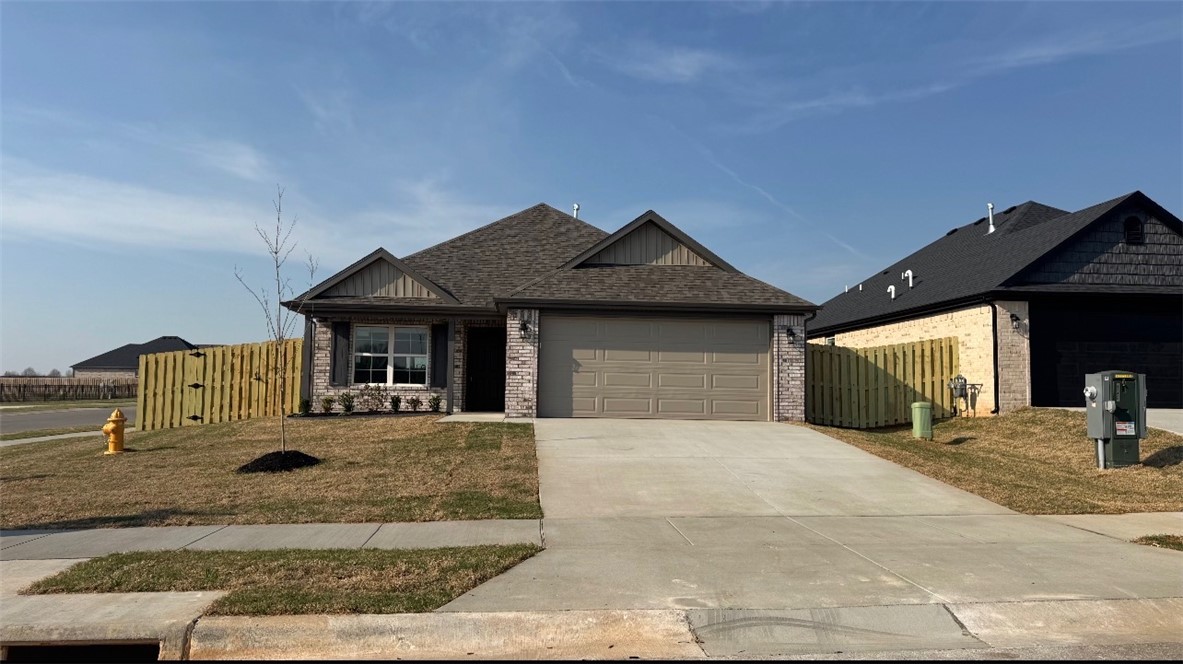 Modern design meets everyday comfort in this beautifully crafted one-story ranch nestled in a vibrant new community. Thoughtfully designed with 3 bedrooms, 2 bathrooms, and 1,669 square feet of well-planned living space, this home offers the perfect balance of style and functionality. The open-concept layout effortlessly connects the kitchen, dining, and living areas—creating an inviting space ideal for gathering with family or entertaining guests. Natural flow and intentional design make every square foot feel purposeful from the moment you step inside. The spacious primary suite serves as a private retreat, complete with a large walk-in closet and a spa-inspired en-suite bath featuring a soaking tub and separate walk-in shower. Two additional bedrooms offer flexibility for guests, a home office, or hobbies. Step outside to the covered back porch—perfect for weekend barbecues, relaxing evenings, or enjoying time with pets and family. A finished two-car garage adds convenience and extra storage.