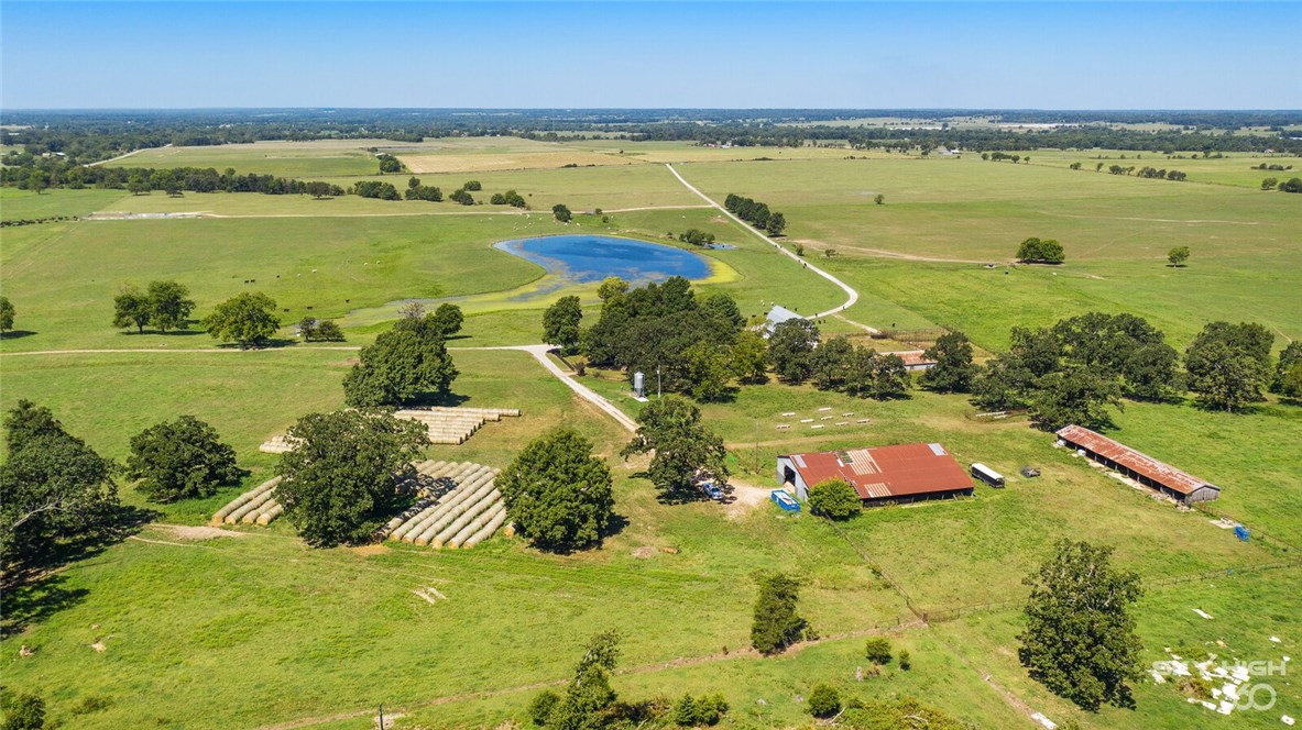 560 +/- acres located on prime location off of Highway 72 and West of Gravette.  Stately working ranch with over 460 acres of pasture and 100+/- acres timber.  Fabulous spring fed lake stocked with fish and year round spring fed creek running through the property.  1,576 sq ft house with 2 bedrooms, 2 full bathrooms and new HVAC.  Property also offers an over 100 year barn with original wood and additional pole barns.  The perfect setting to hunt and fish and the original site of Camp Walker Civil War site.  All structures are sold as is.
