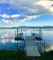 Sold Prior to entering MLS.You truly have to see this property to feel the peace that comes over you when you sit on that back deck with a beautiful lake front. The charm this home exudes will make you feel at home. In addition to a New HVAC system, New Water heater, and a brand New roof, sellers have included the lot across the street in the price! This is a wonderful opportunity to enjoy beautiful views and a fun summer out on the lake!