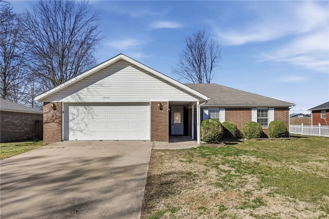 Well-maintained 3 bedroom, 2 bath home with 2-car garage located one block south of Bentonville High School. Light and bright interior with new paint throughout and new flooring in the living room and bedrooms. Spacious eat-in kitchen with pantry and good natural light. Living area features a gas fireplace and an open feel. Faux wood blinds throughout. Exterior offers a level lot and a fenced backyard suitable for pets or play. Move-in-ready home in a convenient central Bentonville location.