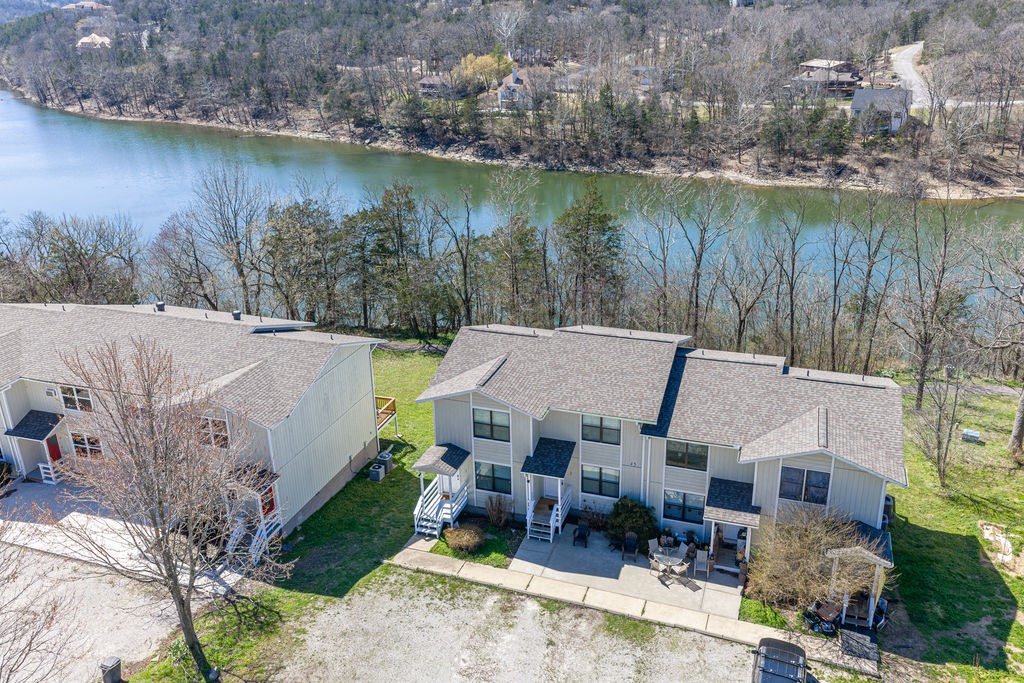 This 2-bedroom, 1.5-bathroom condo overlooks the pristine waters of Table Rock Lake. The main level offers living and dining areas, complete with a convenient half-bath for guests. From the kitchen step out onto the first of two private decks to enjoy refreshing breezes and the ultimate spot for morning coffee with views of the lake. The upper level features two bedrooms, including a primary with its own exclusive second-story deck. As part of Holiday Island, enjoy a wealth of amenities that enhance the living experience including two pools, tennis/pickleball courts, and two golf courses 
Whether you're seeking a full-time residence or a weekend getaway, this condo combines the best of Holiday Island & Table Rock Lake living! New roof 2025 and new decks 2026. Sold with all furnishings and appliances!