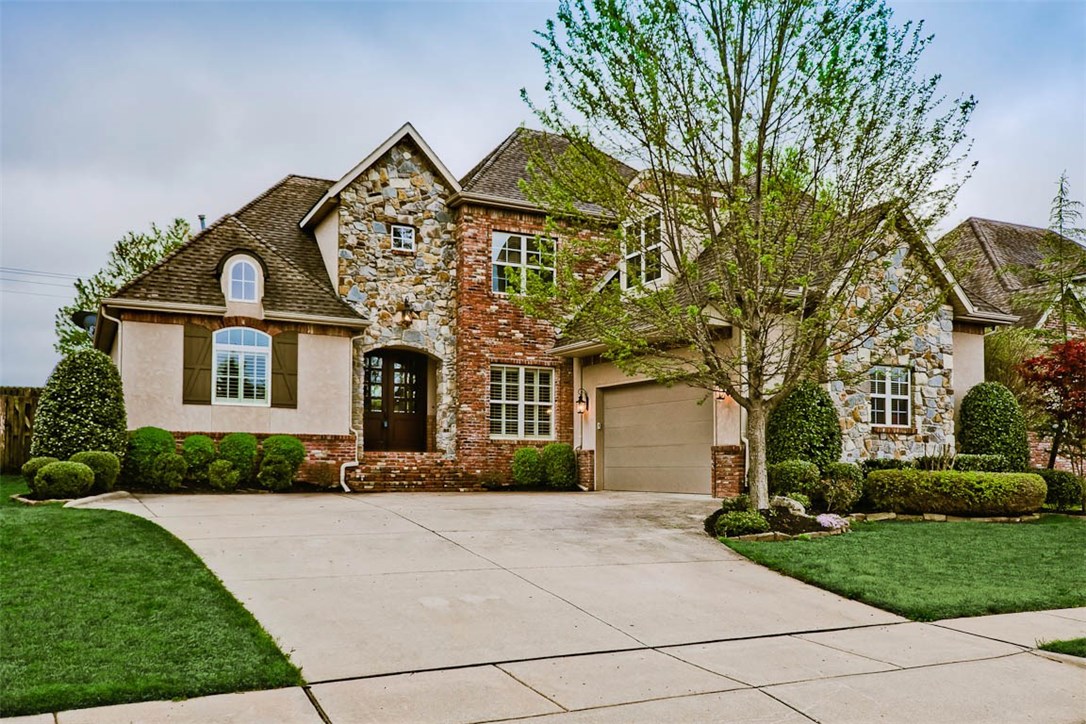Hurry! This gorgeous, move-in ready home is beyond special! This home has everything! Classic European design w/modern appeal, open floor plan, newer, beautiful hardwood flooring, plantation shutters, gas range, granite counter tops, breakfast bar, upgraded lighting, built-ins, covered porch, surround sound, Extra large utility room w/built in cubbies, 2 baths upstairs - half bath on main level- the list goes on! Stunning double-door'd entry w/ upgraded Travertine tile in the spacious entry will