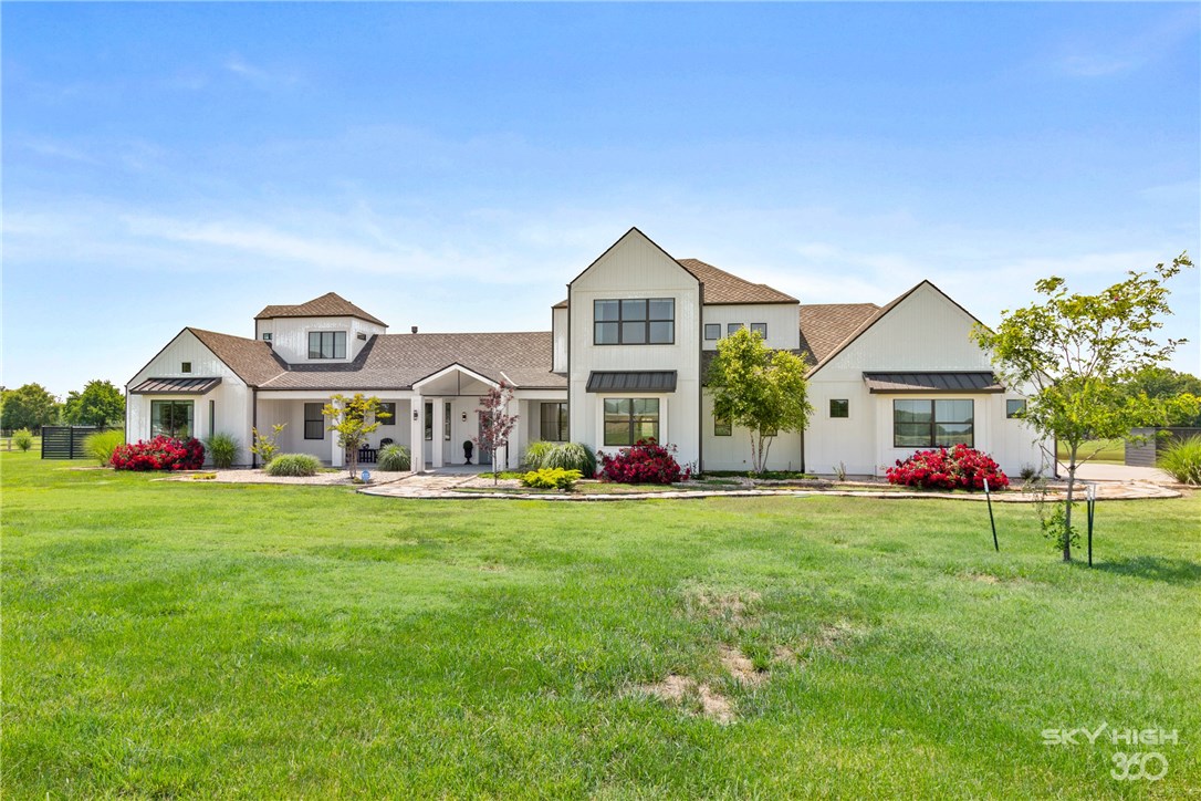 Immerse yourself in luxury in this remarkable custom home on 6.42 lush acres w/ private stocked pond. Open floor plan with lots of natural light and high end modern features. Huge living room with modern linear natural gas fireplace that opens to gorgeous kitchen with two of every high end appliance. Gameroom, office, two laundry rooms, mudroom, family room, storage rooms and all large bedrooms. Master features private patio & ensuite w/ steam spa shower. Whole house generator and water filtration system.