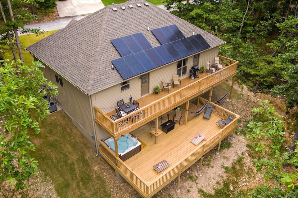 Welcome to a rare opportunity to own a fully furnished, income-producing short-term rental in one of NWA fastest-growing outdoor destinations.This property is being offered completely turnkey, w/ future bookings already in place, allowing you to step in and generate revenue from day one. Designed to comfortably accommodate up to 10-14 guests, ideal for families, group travelers, & mountain bike enthusiasts seeking both convenience and experience.This property is more than just a home, it's a fully operational hospitality asset in the heart of an exciting & thriving tourism destination. It is a proven STR with professional management already in place. Additional amenities include a game room garage conversion, a hot tub, bunk room, a full solar panel system with 30% energy savings to enhance your ROI & reduce expenses all in the middle of world class mountain biking trails and less than 10 minutes to the new OZ Trails Bike Park set to open in June of 2026.This is your chance to invest in the future of Bella Vista!