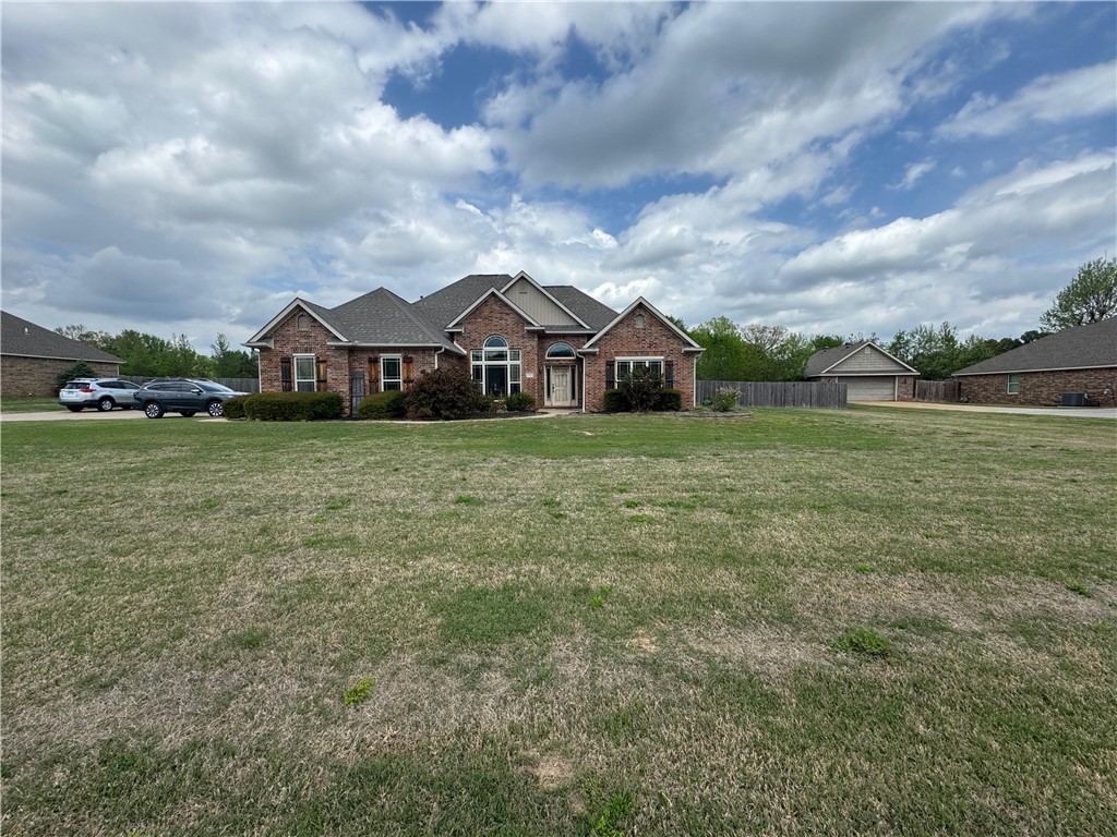 Welcome to 628 W Newberry Rd in Alma's sought-after Heritage Hills neighborhood! This beautifully maintained 4-bedroom, 2-bath home offers 2,073 sq ft of comfortable living on a generous 0.82-acre lot. Built in 2007, you'll immediately appreciate the soaring cathedral ceilings, rich hardwood floors, and cozy gas fireplace — perfect for relaxing evenings at home. The spacious primary suite features a walk-in closet, whirlpool tub, and walk-in shower. Step outside to enjoy the covered porch, deck, and patio, ideal for entertaining family and friends. The classic brick and cedar exterior, professional landscaping, and 2-car attached garage deliver incredible curb appeal. Alma schools, and a location just minutes from shopping, this home truly checks every box. Schedule your private showing today!
