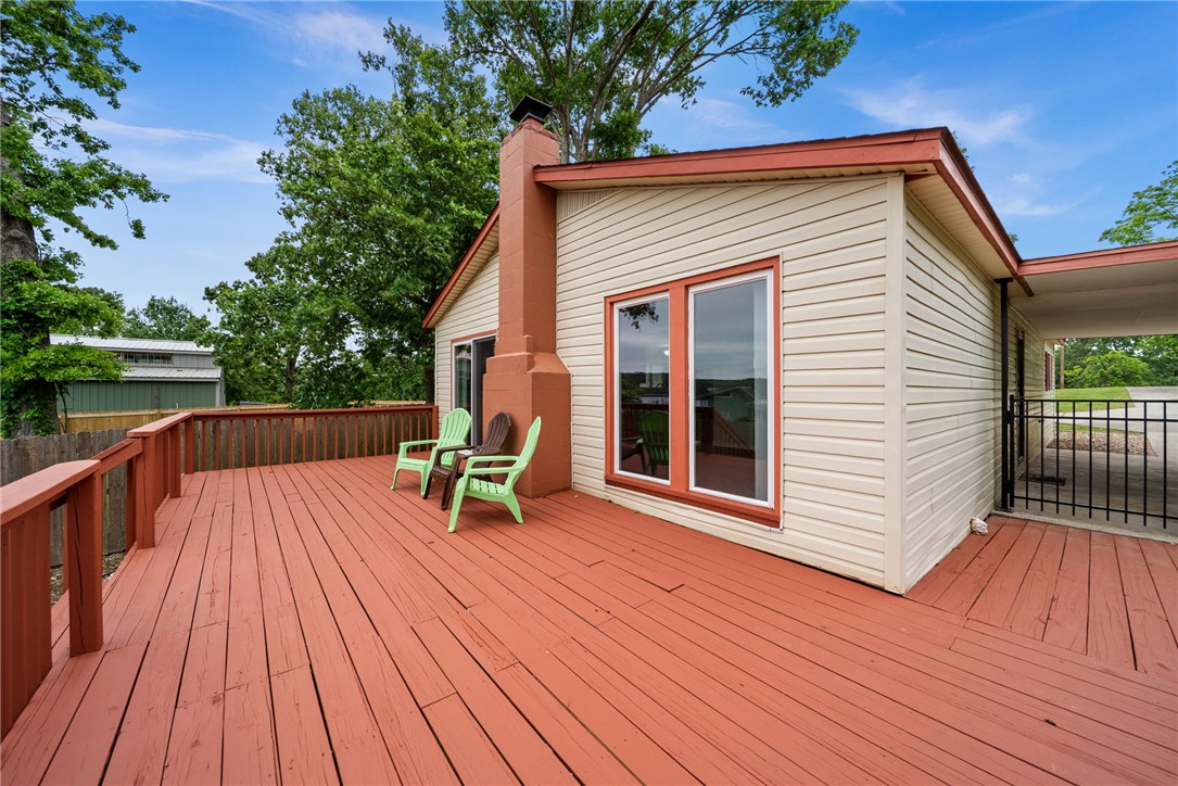 Fall in love with this move in ready lakeview house just 10 minutes from Rogers, and 5 minutes from Beaver Lake in Beaver Shores subdivision.  A large back deck for the whole family, lakeview BBQ gatherings, anyone?  An easy living two bedroom two bath house perfect for a small family or anyone wanting to trade the city hustle for more lake life!  Roof shingles replaced after the 2024 storm, kitchen has pretty granite countertops and all appliances stay with the house!  Spotless and dandy!