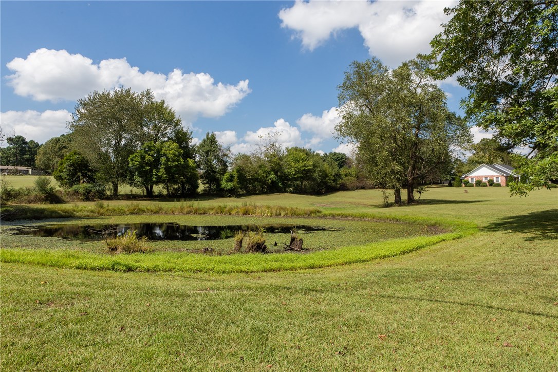 Fantastic Location!  East side Fayetteville in the Vandergriff/McNair school district.  Just outside of the Fayetteville city limits, no neighborhood restrictions, beautiful pond, and no neighbors behind the lot offering a little extra privacy. Close to shopping, restaurants, schools, banking, medical offices, and more.  Reference MLS#'s 1071856,1073339, 1060113