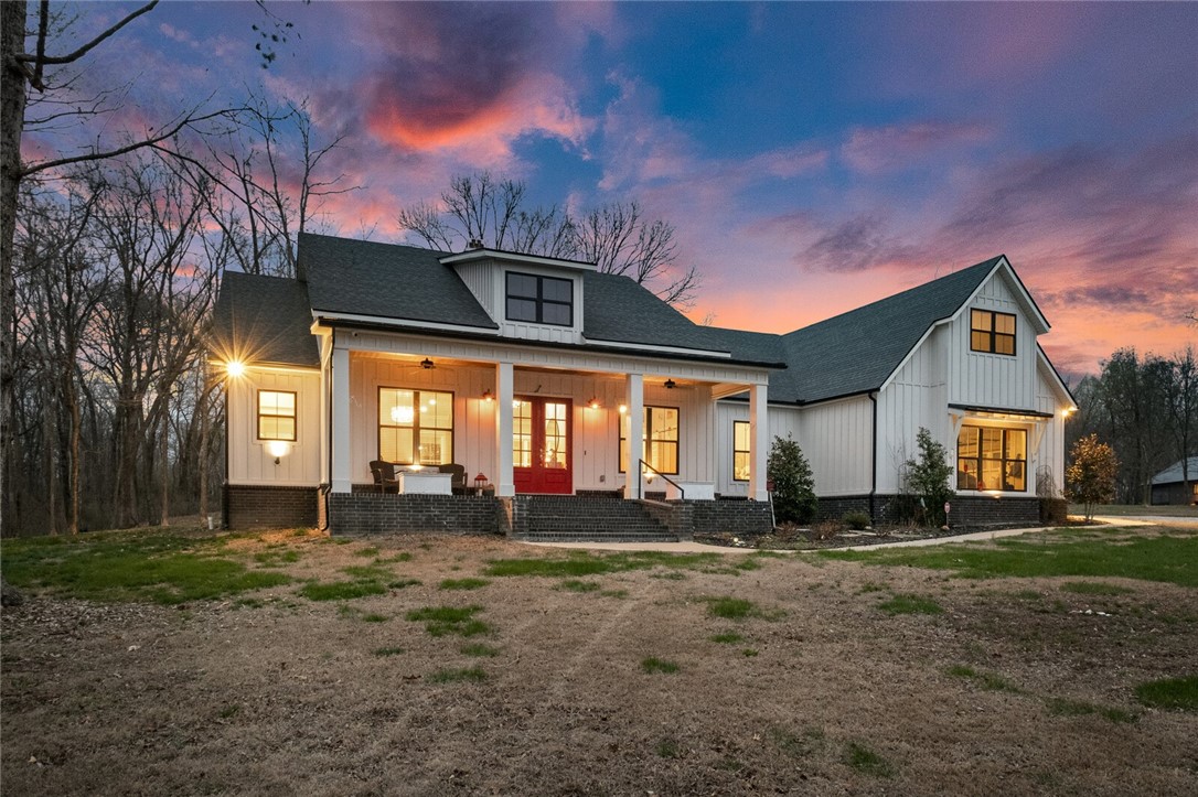 This stunning custom home is situated on 5 acres with a tree lined driveway offering the perfect blend of natural beauty and luxurious living. As you step inside, you'll be greeted by double doors and a barreled entryway.  The beautiful custom kitchen is complete with massive island and top-of-the-line Fisher Paykel appliances. 

The heart of the home is the spacious living room featuring a large wood-burning fireplace and plenty of room for relaxation and entertainment.  The owners suite is one you don't want to miss! There is a private retreat that can be used as a gym, office, yoga room or a small media room.

Raised garden beds were installed for your very own farm to table experience, with a hermetically sealed storage shed for all the gardening tools you can buy.  A brand new oversized Jacuzzi hot tub is included!  The oversized garage has an in ground storm shelter easily accessible.  New top of the line security and camera system, surround sound inside and out, LED lighting, and more!