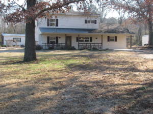 THIS HOME HAS IT ALL....Home, Shop, plus a workshop set up for a business. Close to town, this home features a 3 bdr, 2 bth, situated on almost 2 acres m/l. Double washer & dryer hookups(1 upstairs & 1 downstairs), master suite, circle drive, city water & well water for watering outside.