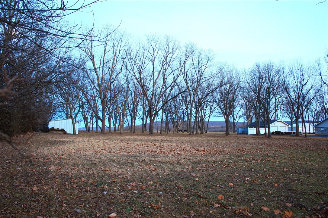 Great size lot with storage buildings! Home in front of lot is also listed for sale.