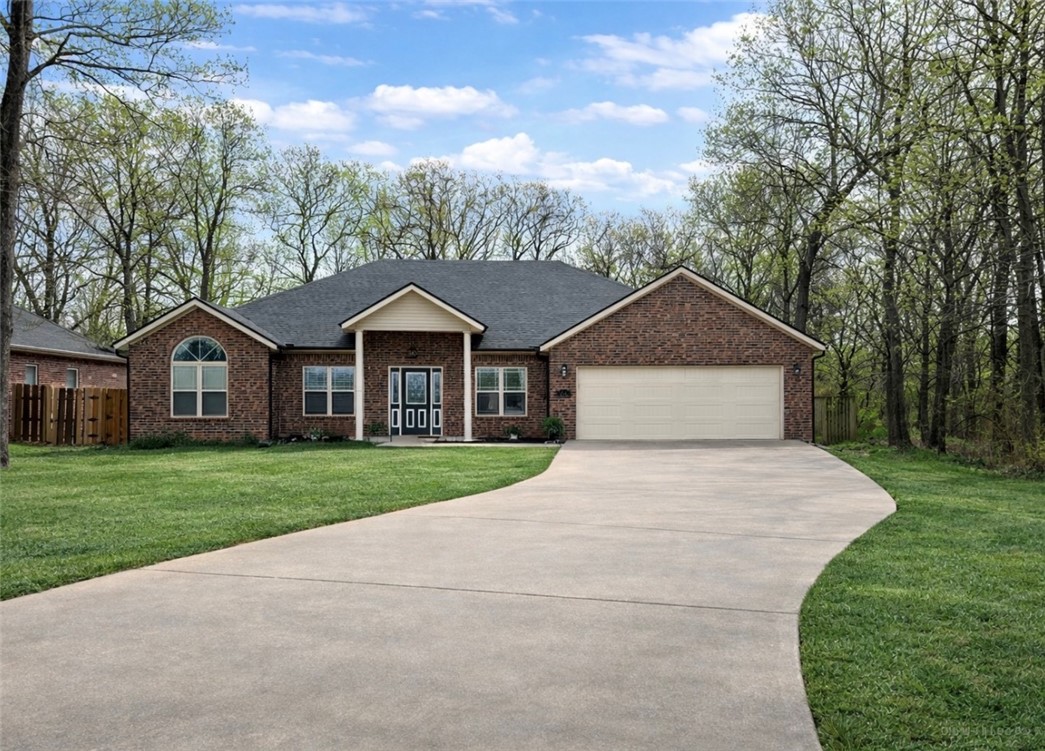 What a perfect location! Be within minutes of shopping, businesses, restaurants, etc. while still feeling you have your own space away from it all. Oversized lot provides additional parking if you need it, and a fantastic backyard for the whole family! You really feel the spaciousness of this home as you walk through the front doors. Freshly polished concrete floors make this home stand out. The living room is large, and check out that beautiful ceiling! Cozy up by the fireplace on those chilly evenings. Formal dining room is great for holidays. Kitchen has and additional eat-in space, granite counter tops, and pantry. Laundry room with utility sink is a plus. Floor plan has primary bedroom on one side with other 3 bedrooms on the other side. Love this primary bathroom! Double shower, double vanities, linen closet, toilet closet, free standing soaking tub, and large walk in closet are an absolute dream! Extended back patio with high ceiling is amazing for enjoying time with friends and family. New roof in 2025.