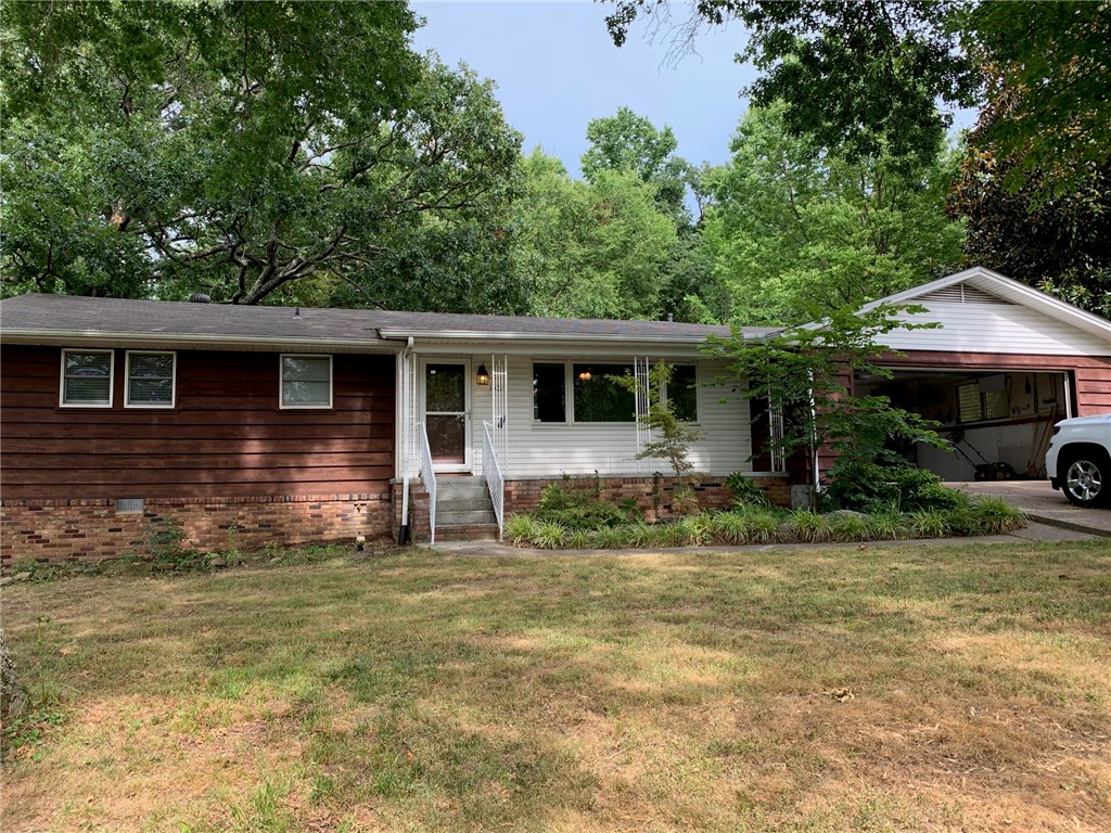Nicely remodeled 3/2 near campus features 2 living areas, 2 car garage, nice backyard, and highefficiency heating and cooling. Refrig, washer, dryer included.