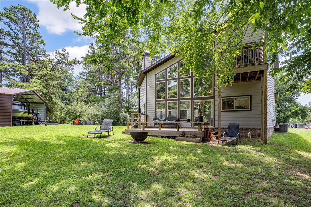 Tucked away in the beautiful War Eagle Marina area, this charming home offers a perfect blend of peaceful surroundings and convenient access to NWA amenities. Enjoy an open and inviting layout with plenty of natural light, a spacious kitchen and comfortable living areas designed for relaxing or entertaining. Enjoy the beautiful view of the lake, co-owned boat dock and the beauty of the area.  Whether you are looking for a full-time residence or weekend retreat on Beaver Lake this property is the one you don't want to miss.