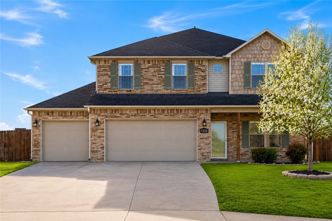 This one backs directly to Shaw Family Park — 120 acres of trails, splash pad, ponds, a dog park, tennis courts, playgrounds, and outdoor fitness areas, all accessible from your own backyard. That's not something you find every day in NWA.
The home offers 4 bedrooms, 2.5 baths, and 2,657 heated square feet across two levels. The main level was freshly painted and features a formal dining room, eat-in kitchen, and a bonus room that works equally well as a second living area or home office. Walk-in closets, luxury vinyl plank, tile, and wood laminate floors throughout.
Out back, a covered patio and pergola overlook the park — a great setup for evenings outside. The backyard is fully fenced with direct park access. A 3-car garage and metal shop round out the storage and workspace options. Metal shop conveys.
The neighborhood itself includes a community pool, basketball court, and baseball fields. Close to shopping, dining, schools, and major NWA corridors.
