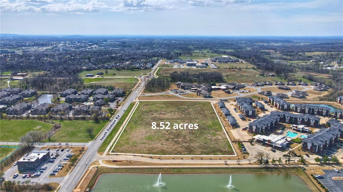 Land for sale strategically positioned on the Rogers/Bentonville border along South Dodson Road near I-49. This +/- 8.52-acre development opportunity presents a rare chance to deliver a high-quality residential and mixed-use community — featuring apartments, townhomes, multi-unit homes, and ground-floor commercial — within one of Northwest Arkansas' most rapidly growing and lifestyle-driven corridors, steps from the Razorback Regional Greenway, minutes from Walmart's global home office, and adjacent to the prestigious Pinnacle Hills district.