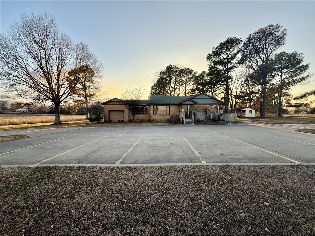 Approximately 560 linear feet of frontage on Highway 71 and approximately 650 linear feet of frontage on Columbus Acres Rd. Prime location with high visibility on the heavily trafficked Highway 71, perfect for a mixed-use commercial development in a rapidly growing area.  The property has a 360 SF storage and a pole shed.  Previous single family residence that was converted to an office.  8 parking spaces on site.
