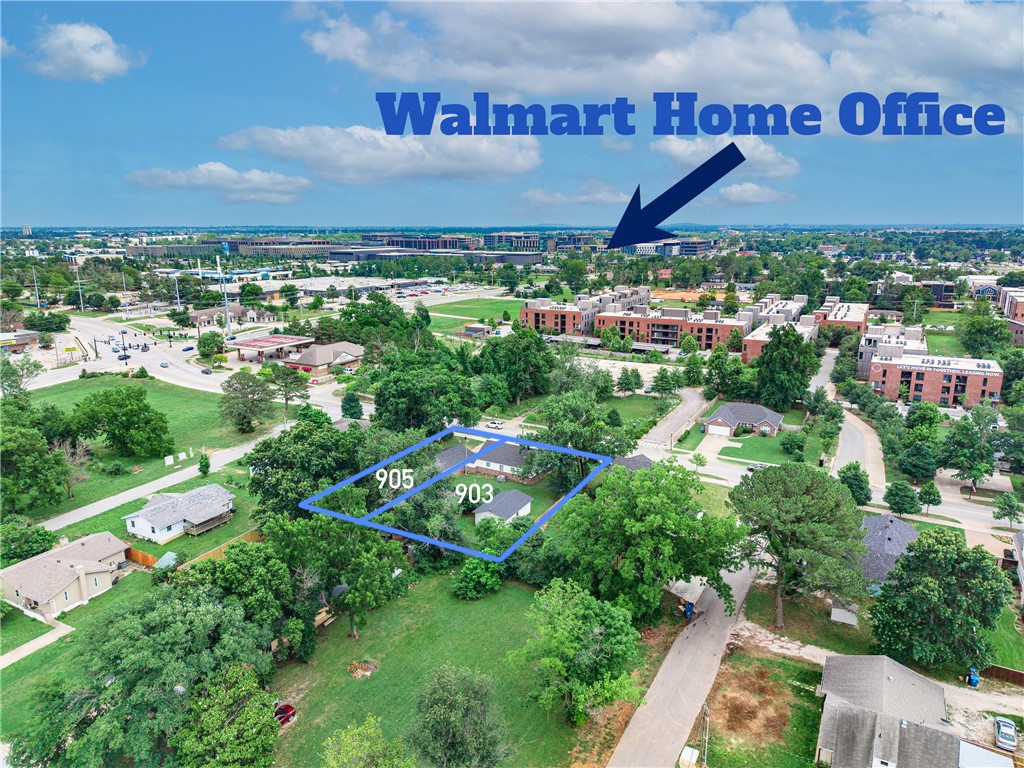 Here's your chance to own nearly half an acre in one of Bentonville's most sought-after locations — where the real value is in the land itself! This 0.43-acre level lot at 903-905 E Central Ave features 125 feet of frontage along a major corridor Walk or bike to Downtown Bentonville, the Walmart Home Office, and some of the best trails in the country — the greenway and mountain biking paths are practically at your doorstep. All utilities are already on site — electric, gas, public water, and sewer — making your future build seamless. The lot is level with existing curbing and sidewalks in place. Whether you choose to renovate, rebuild, or start fresh, this location is truly unmatched. Opportunities like this — nearly half an acre this close to downtown, world-class trails, and everything Bentonville has to offer — simply don't come available often. Come see it for yourself!