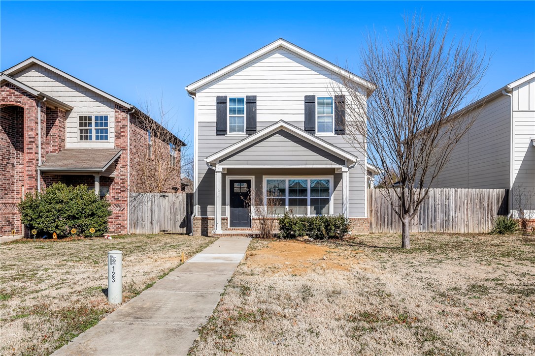 A beautiful Craftsman Style row house located across from one of the best Elementary schools in Rogers. Tucker Elementary. As you walk in the WOW factor with the tall ceilings and the open format. Stunning granite on all countertops, and Island. This has a Eat in dining area in the kitchen and a spacious pantry.
This stunning home has a privacy wood fence with gate, 2" blinds, walk in closets, stainless appliances. Washer, Dryer, and Side by Side Stainless refrigerator convey with home. It is close to Restaurants, shopping and Schools.  This is also listed as a rental - see MLS #1343433.