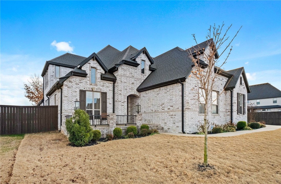Welcome to Lochmoor Club. One of Bentonville’s most desirable neighborhoods where community, convenience and adventure meet. This Phase 2 home sits on a rare 0.33-acre lot (larger for the development) and backs directly to the Bentonville Greenway. That means you can hop on your bike and reach all the incredible trail-connected destinations that make NWA so special- safely and easily from your backyard. A 3-car garage provides space for bikes, gear. Inside: soaring ceilings, 10’ doors on the main level, triple crown molding throughout the main-level common areas. Open kitchen with ceiling-height cabinetry, quartz countertops, and gas cooktop, flowing into living and dining spaces. Main level includes 4 bedrooms and 3 full baths, with the 4th bedroom set up as an office. Upstairs is a large bonus room with storage closet and half bath. Covered patio features fireplace and remote-controlled mechanical screens. Amenities include pool, baby pool & spa, tennis, basketball, volleyball, playground, pavilion & green space.