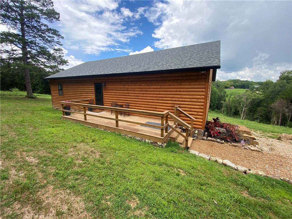 Outstanding opportunity to own a fully furnished 3BR/2BA home built in 2026, offering 1664 SF on 11.64 ac in the heart of the Ozark Mountains. Bordering Ozark National Forest/Buffalo National River land, this property provides direct access to nature while being just 4 miles from the Erbie Access, 3 miles from the Pruitt Access, & only 4 miles north of Jasper, with just 1 mile of dirt road off Hwy 7 in beautiful Newton County, Arkansas. Enjoy breathtaking mountain views & approximately 5 ac of pasture. Interior features include hickory hardwood floors, granite countertops, 9' ceilings, 2x6 construction, all-foam insulation, & reliable direct-wired high-speed internet. Enjoy the peace by setting around the outdoor fire pit or preparing a meal on the deck while taking in the views. Currently operating as a highly successful short-term vacation rental, this turnkey property is ideal as an income-producing investment, vacation retreat, or full-time residence in one of Arkansas's most sought-after outdoor destinations.
