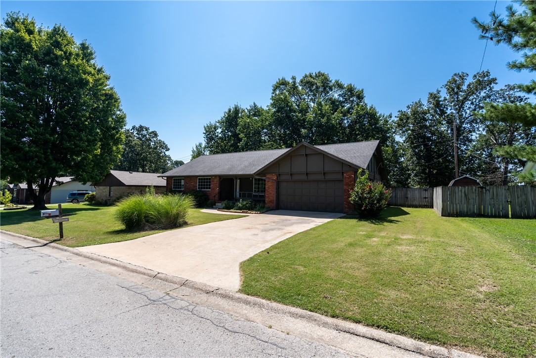 Wonderful home in a great, quiet neighborhood close to Walmart Neighborhood Market, John Brown University, McDonalds, public schools, parks, etc. Completely remodeled, and ready for someone to call home. The property features 3 bedrooms, 2 baths, large, oversized garage, a spacious open concept living room, updated kitchen with granite countertops and back splash, along with a large and inviting outdoor area that is perfect for entertaining guests or relaxing in the sunshine. No Carpet! Every room has big windows to allow great natural light! Whether you are looking for a new home or an investment opportunity, this property has it all. Don't let this one slip through your fingers! Schedule your private tour today.