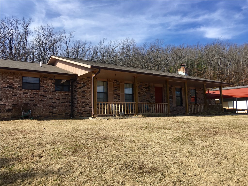 Wonderful views from this secluded Greenland find. Comfortable home with spring fed pond, quiet serenity and a huge shop building. Could be perfect set up for home/business situation.