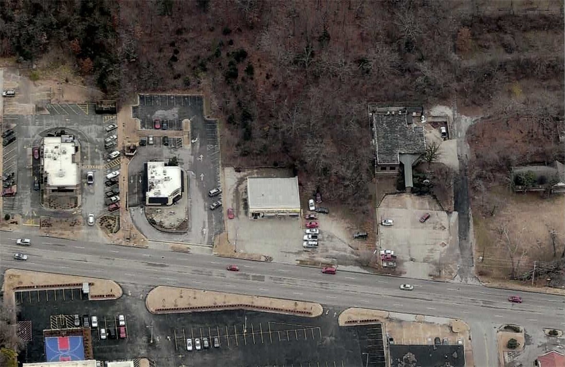 Prime ±0.99-acre Urban Corridor development site on highly traveled (24,000 ADTC) N College Ave in Fayetteville, AR! Offering 89 ft of highway frontage, zero density limits, and zoning for up to 8 stories, this high-visibility tract is perfect for an iconic mixed-use project. Permitted uses by right include multi-family (3-4 family & multi-family dwellings), offices/studios, hotels, retail shopping goods, eating places, sidewalk cafes, liquor stores, small-scale production, and short-term rentals. Any combination of these uses is allowed per lot! Unbeatable location next to the new Ramay Junior High and just one lot from the new signalized intersection at College and Poplar. Ideal for a walkable commercial or residential hub in a booming redevelopment corridor. Survey available. Seller will consider a long-term ground lease, creating a rare opportunity for developers and investors seeking a premier location with maximum versatility and long-term growth.