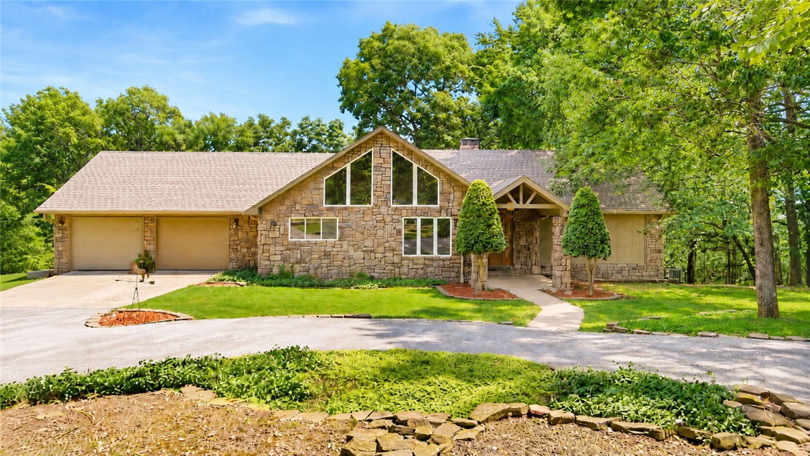 Discover the perfect blend of modern comfort and working farm utility on 17.35+/- pristine pasture acres.
This stunning farmhouse offers timeless character with open concept living. Large windows flood the
space with natural light. The covered patio out back is perfect for outdoor dining and
entertaining  The property features an oversized in-ground pool equipped with a diving
board and patio lounging areas, a 10 stall (6 interior & 4 exterior) 40x40 barn with an office, tack/feed
room, & hay storage. Perfectly positioned just 10 minutes from the world-class amenities of Bentonville,
and the convenience of XNA. This estate offers the quiet life without sacrificing accessibility. Whether
you’re raising livestock or seeking a private retreat, this is a rare find in NWA. Experience the freedom of
the farm with all the modern comforts you crave. Adjacent acreage & second home is available! Private
pond will be accessible via a shared use agreement with the neighboring parcel. Parcel acreage is
approximate.