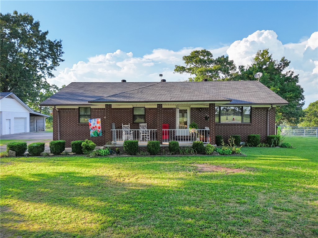 Mountain View Mini-Farm on 5 Acres!! A 3BR/2BA brick home located outside of city limits Features a detached 2 car garage and a workshop, a large unique storm shelter, beautifully landscaped, and a fenced backyard. The 5 acre property is fully fenced and improved with a 2 stall horse barn. Large covered RV parking with pad provides excellent storage for your RV or equipment. Enjoy the breathtaking mountain views and peaceful country living while being just minutes from town. A great opportunity for horse lovers, hobby farmer or anyone seeking space and privacy!