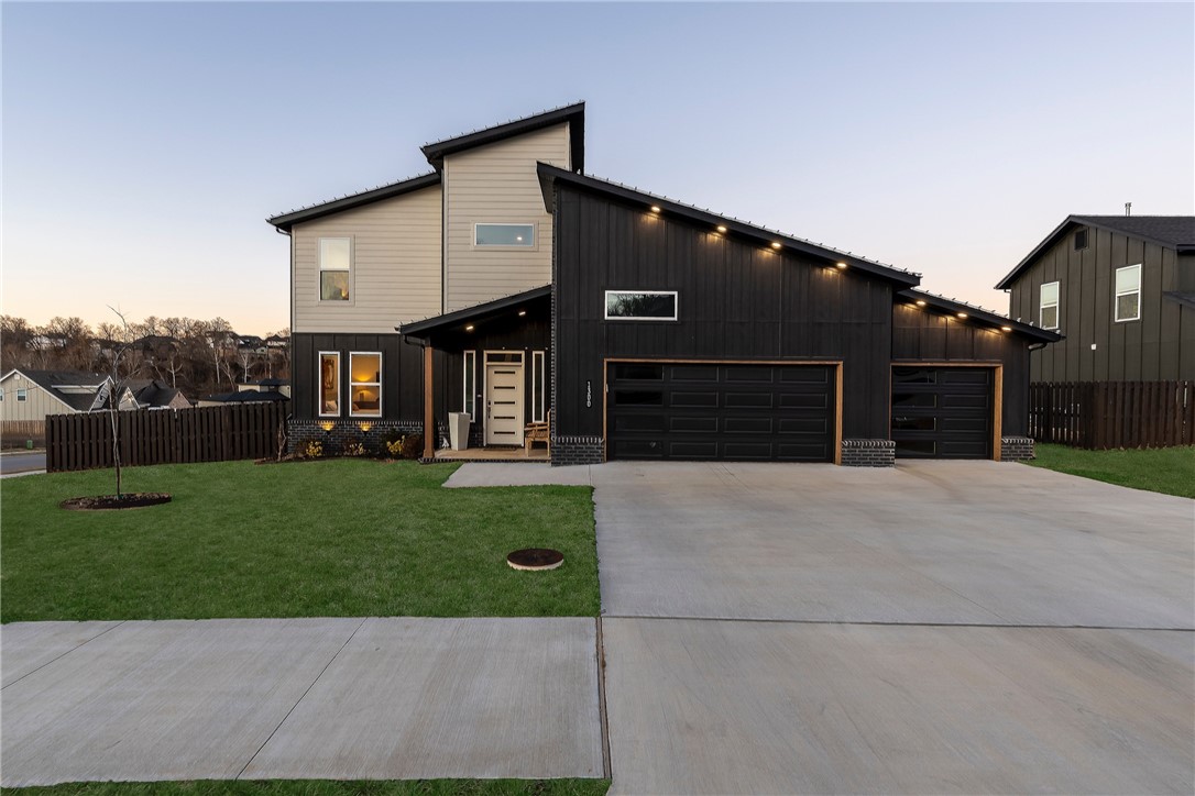 Modern design meets luxury living in this impressive 4-bedroom, 3–full-bath home featuring an open floor plan and a versatile bonus/flex area that adds valuable extra living space. Tall ceilings and clean architectural lines create a bright, spacious atmosphere ideal for everyday living and entertaining.
The kitchen is a standout with beautiful, leathered granite countertops, a convenient pot filler, and a huge pantry offering exceptional storage. Upscale finishes and thoughtful details are found throughout.
Located on a prime corner lot, the outdoor space is designed to impress with custom hardscaping, a built-in fire pit, hot tub area, and a covered back deck perfect for year-round enjoyment. A 3-car garage provides ample parking and storage. Just steps from Big Sugar Golf Course, this modern home offers luxury touches, functional design, and an unbeatable location. Schedule your private showing today.
