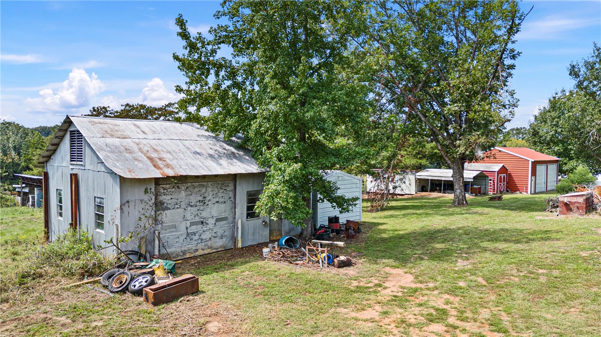 74.30 Acres Located on State HWY 247 complete with great views, ponds, pasture and woods. Easy access to interstate 40 East or West from here. Hay barn with some fence. NO MINERALS TO CONVEY. DEED RESTRICTION NO MOBILE HOMES. Cattle, recreational or just the peace and quiet countryside can all be found on this unique property 1st time ever offered!