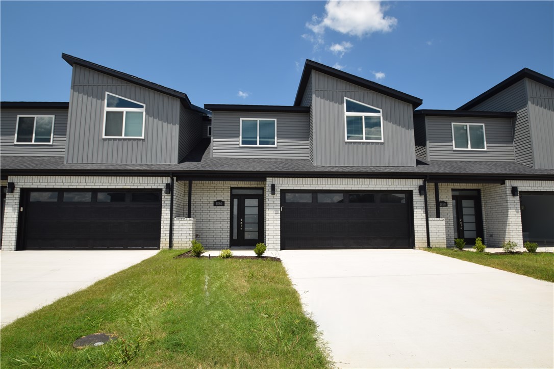 Brand new modern design! This bright 3-bedroom, 2.5-bathroom home features an open living layout with high ceilings and lots of natural light. The kitchen comes with granite countertops, stainless steel appliances, a gas range, and a large pantry. For your convenience, a brand-new side-by-side refrigerator, washer, and dryer are all included. The main-floor primary bedroom has a great walk-in shower and a huge closet. Upstairs, you will find two more bedrooms, a full bath, and extra attic storage. The home features beautiful tile in the main areas, luxury vinyl in upstairs bedrooms,  2" faux blinds, a private back patio, and a fully fenced yard. This home sits in a fantastic location within the top-rated Bentonville School District. You will love being just minutes from the walking paths at McKissic Springs Park and less than 10 minutes from the world-class trails and paths at Coler Mountain Bike Preserve.  Non smoking property and pets allowed with owner approval and additional deposit.
