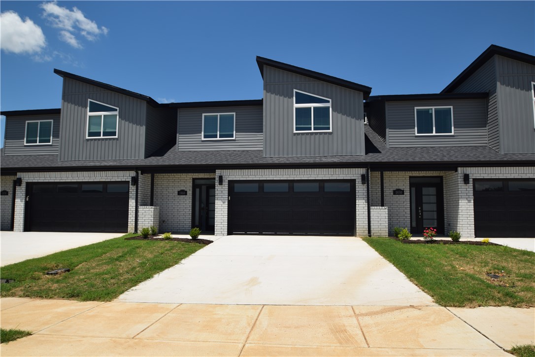 Brand new modern design! This bright 3-bedroom, 2.5-bathroom home features an open living layout with high ceilings and lots of natural light. The kitchen comes with granite countertops, stainless steel appliances, a gas range, and a large pantry. For your convenience, a brand-new side-by-side refrigerator, washer, and dryer are all included. The main-floor primary bedroom has a great walk-in shower and a huge closet. Upstairs, you will find two more bedrooms, a full bath, and extra attic storage. The home features beautiful tile in the main areas, luxury vinyl in upstairs bedrooms,  2" faux blinds, a private back patio, and a fully fenced yard. This home sits in a fantastic location within the top-rated Bentonville School District. You will love being just minutes from the walking paths at McKissic Springs Park and less than 10 minutes from the world-class trails and paths at Coler Mountain Bike Preserve.  Non smoking property and pets allowed with owner approval and additional deposit.