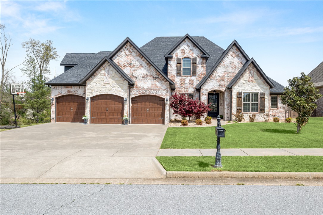 Gorgeous Woods Creek home w/ private pool on 1+ acre! Amazing layout feat. 5BR, office & bonus rm. Foyer opens to dining (L) & office (R). Living rm flows to kitchen w/ brick FP. Eat-in kitchen is the heart of the home w/ lg pantry, bar, island, gas range & Bosch built-in oven/micro. Primary suite offers pool/backyard views; French doors lead to spa-like bath w/ clawfoot tub, double vanity & lg tiled shower. 2 guest BRs + bath, laundry & guest bath on main. Upstairs: built-in desk, 4th BR w/ WIC + storage & bath access, spacious bonus/playroom. 5th BR w/ wet bar & bath—ideal in-law or flex space. Outdoor oasis: screened porch, lg patio, in-ground pool, firepit & lush landscaping for privacy. Prime location mins to Downtown Bentonville & Walmart Campus.