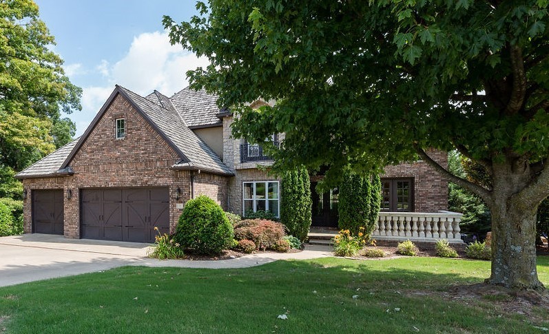Pinnacle Country Club living with beautiful views of the 5th green and tee box.  Enjoy 5,265 heated sq ft with 5 bedrooms and 4.5 bathrooms, oversized eat in kitchen, formal dining, study, great room w/ incredible views, theater room, wet bar, bonus, separate laundry, and second living.  Amenities include gorgeous hardwood floors, vaulted ceilings, custom cabinetry, all wet bar and kitchen appliances convey, tons of storage, double crown molding,  beautiful outdoor living space w/ a fire pit and koi pond, and a 3 car garage.  Basement has a heated and cooled room w/ French doors to accommodate a golf cart. Community pool and tennis court.  Zoned for Bentonville schools.
